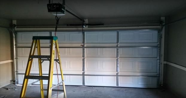 Before a completed garage door contractor project in the  area